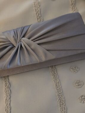 Charming Charlie Silver Satin Twist Knot Clutch
